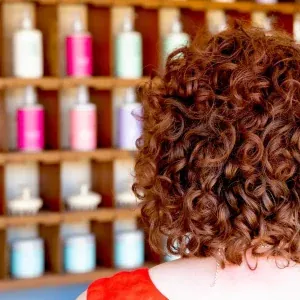 Rich brunette curls after colour, by the product shelf